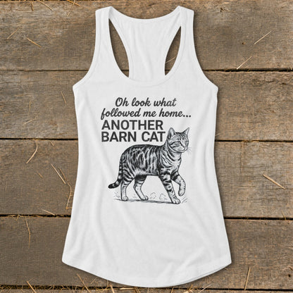 White tank top with a tabby cat illustration and the text "Oh look what followed me home... ANOTHER BARN CAT".