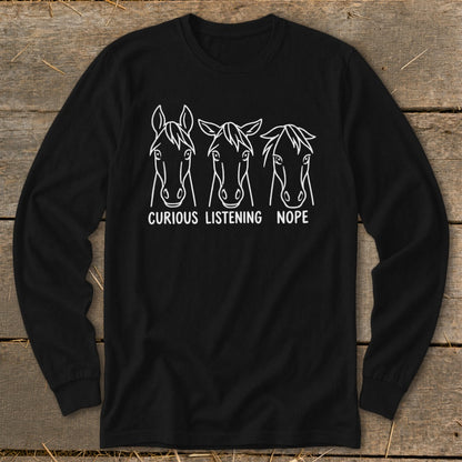 Black long-sleeve t-shirt with a white graphic of three horse heads labeled Curious, Listening, and Nope.