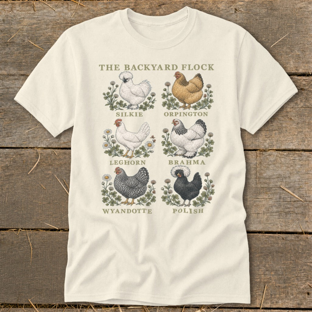 The Backyard Flock t-shirt displays six chicken breeds: Silkie, Orpington, Leghorn, Brahma, Wyandotte, and Polish.