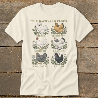 The Backyard Flock t-shirt displays six chicken breeds: Silkie, Orpington, Leghorn, Brahma, Wyandotte, and Polish.