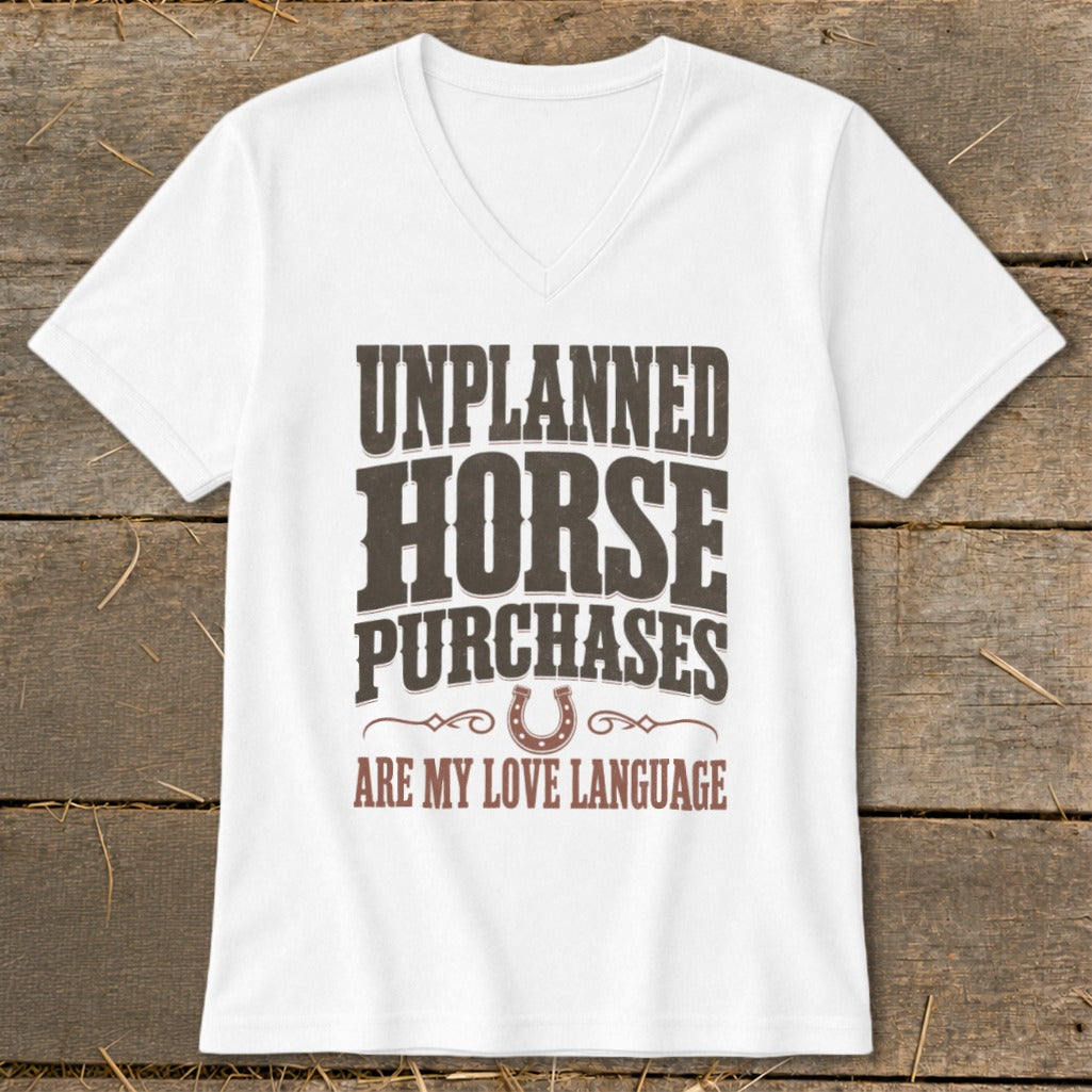 White v-neck t-shirt with "UNPLANNED HORSE PURCHASES ARE MY LOVE LANGUAGE" text.