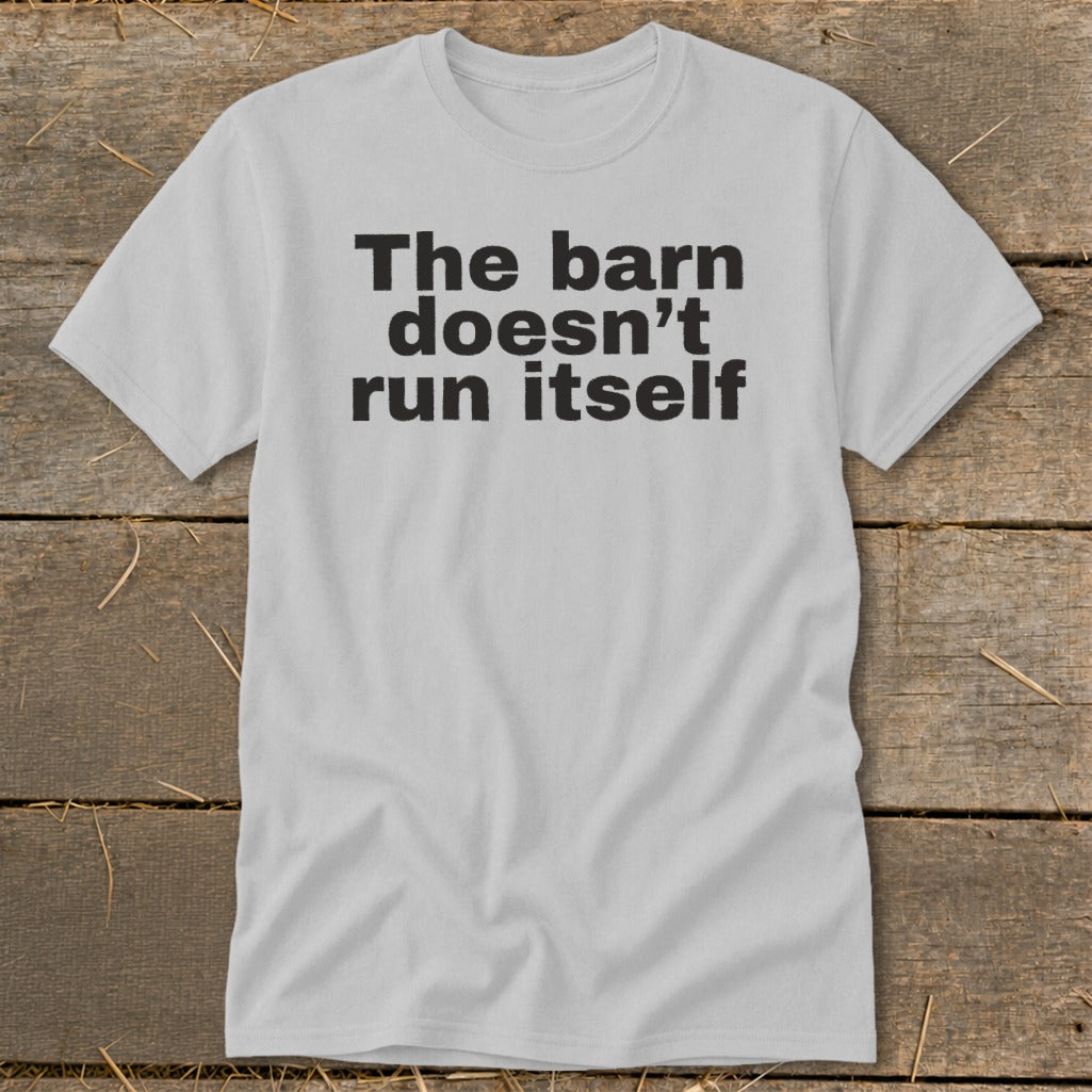Light grey t-shirt with black text "The barn doesn't run itself".