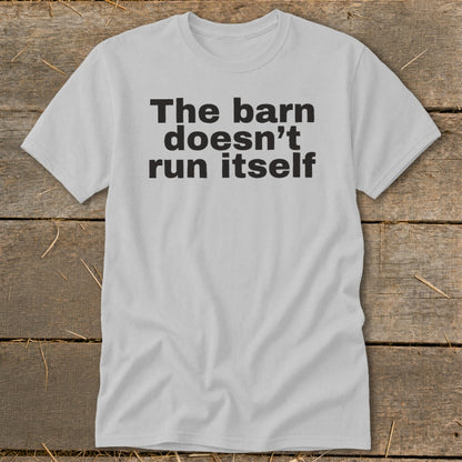 Light grey t-shirt with black text "The barn doesn't run itself".
