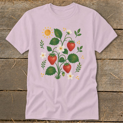 Pink t-shirt with a whimsical strawberry plant and sun graphic.