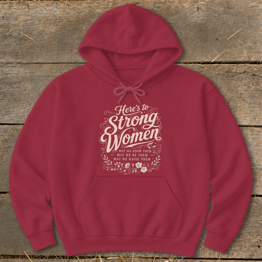 Maroon hoodie with "Here's to Strong Women" text and floral accents.