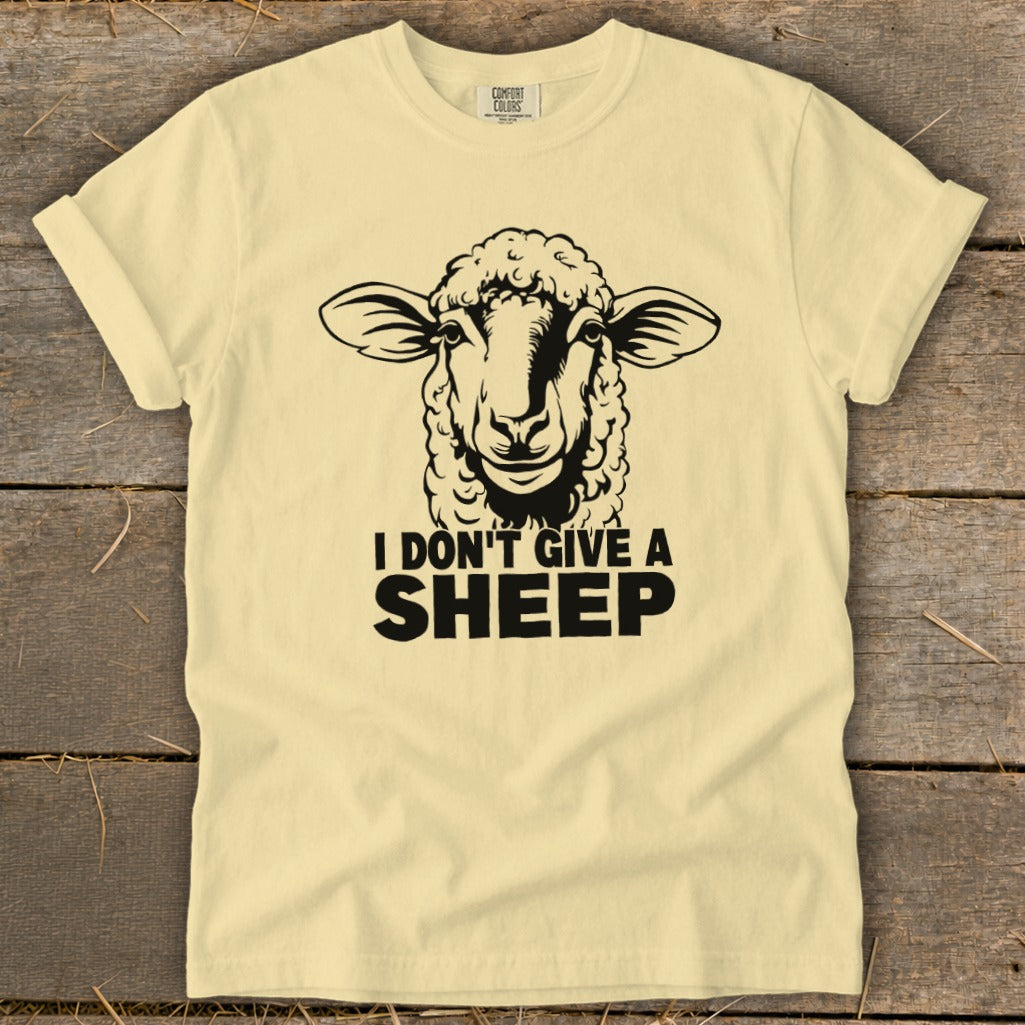 Yellow t-shirt with black print of a sheep and "I DON'T GIVE A SHEEP".