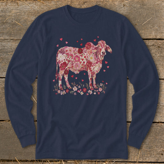 Brahma cow illustration filled with pink flowers and hearts on a navy long-sleeve shirt.