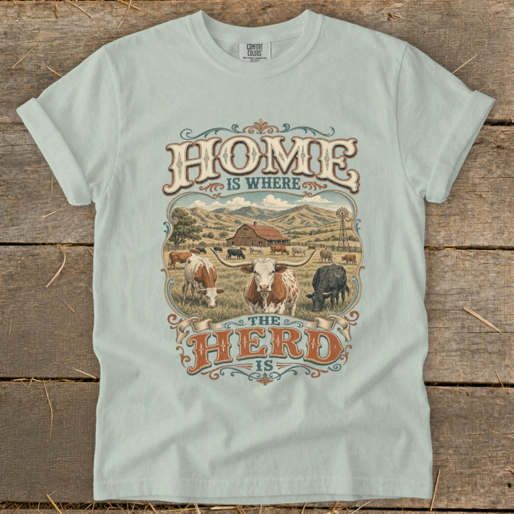 T-shirt with "Home is Where the Herd is" text and a farm scene with cattle.