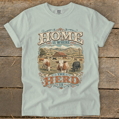 T-shirt with "Home is Where the Herd is" text and a farm scene with cattle.