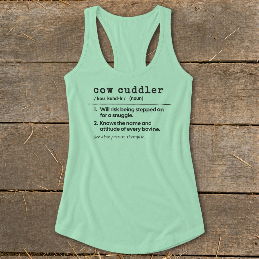 Mint green tank top with "cow cuddler" definition printed in black.