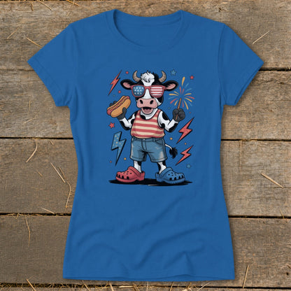 Cartoon cow wearing sunglasses holding a hot dog and sparkler.