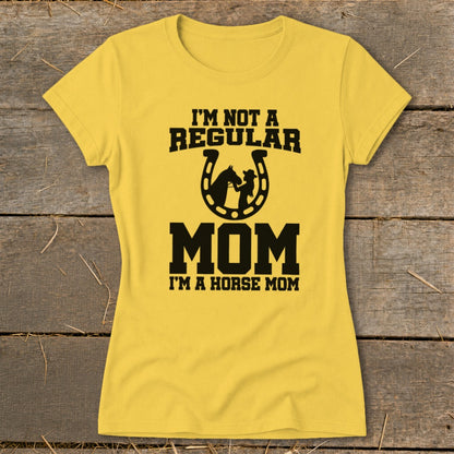Yellow t-shirt with text "I'M NOT A REGULAR MOM I'M A HORSE MOM" and horseshoe graphic.