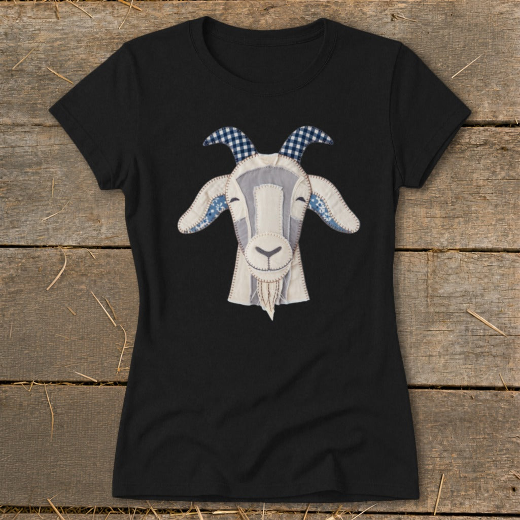 Black t-shirt with a patchwork goat face graphic with blue gingham horns and ears.