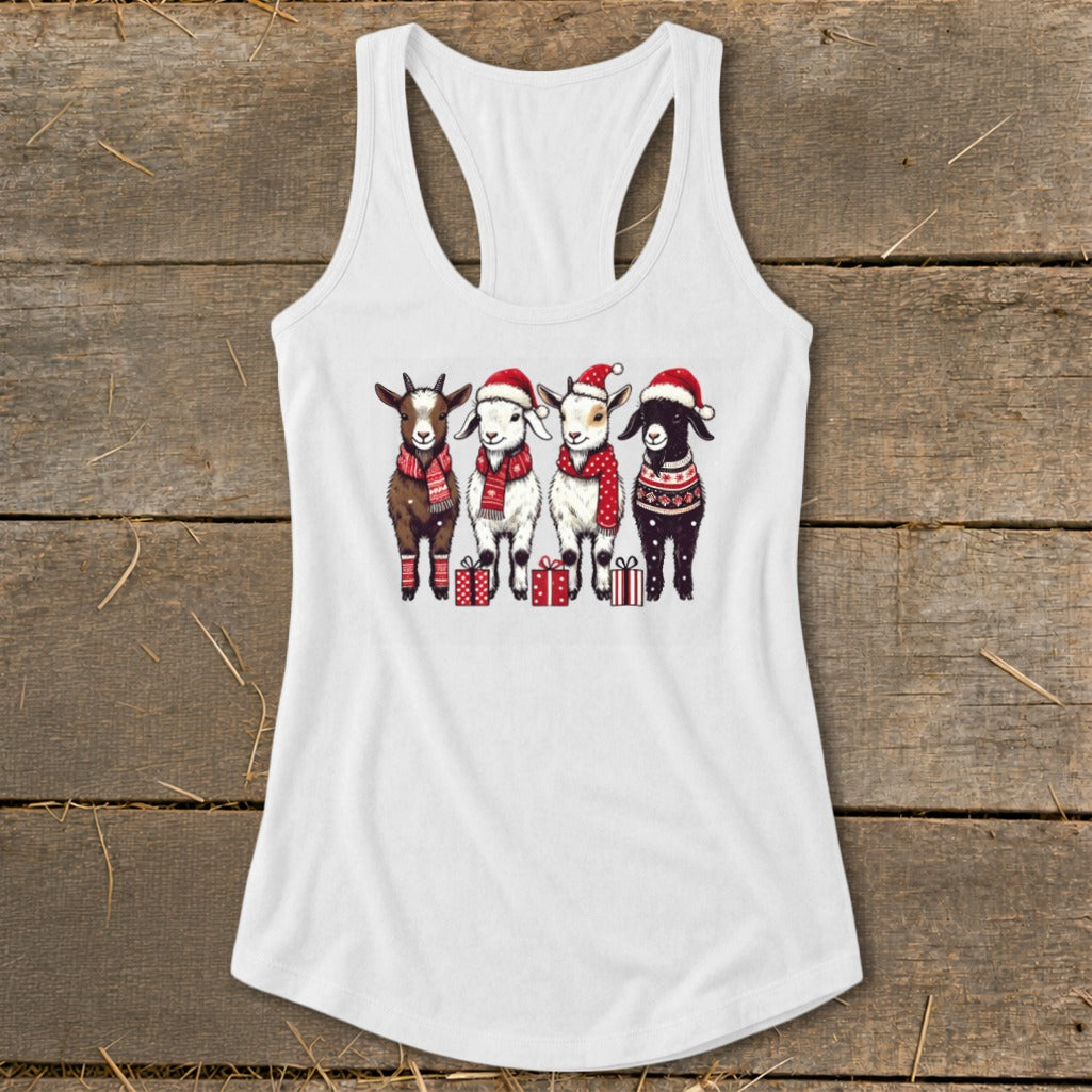 Four goats wearing Santa hats and scarves stand with gifts.