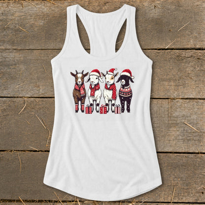Four goats wearing Santa hats and scarves stand with gifts.