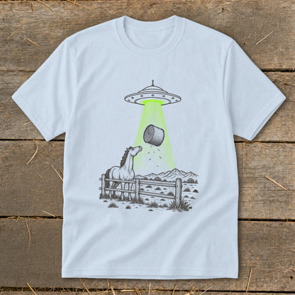 UFO beaming a hay bale from a horse in a fenced pasture.