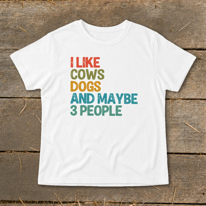 White t-shirt with text "I LIKE COWS DOGS AND MAYBE 3 PEOPLE".