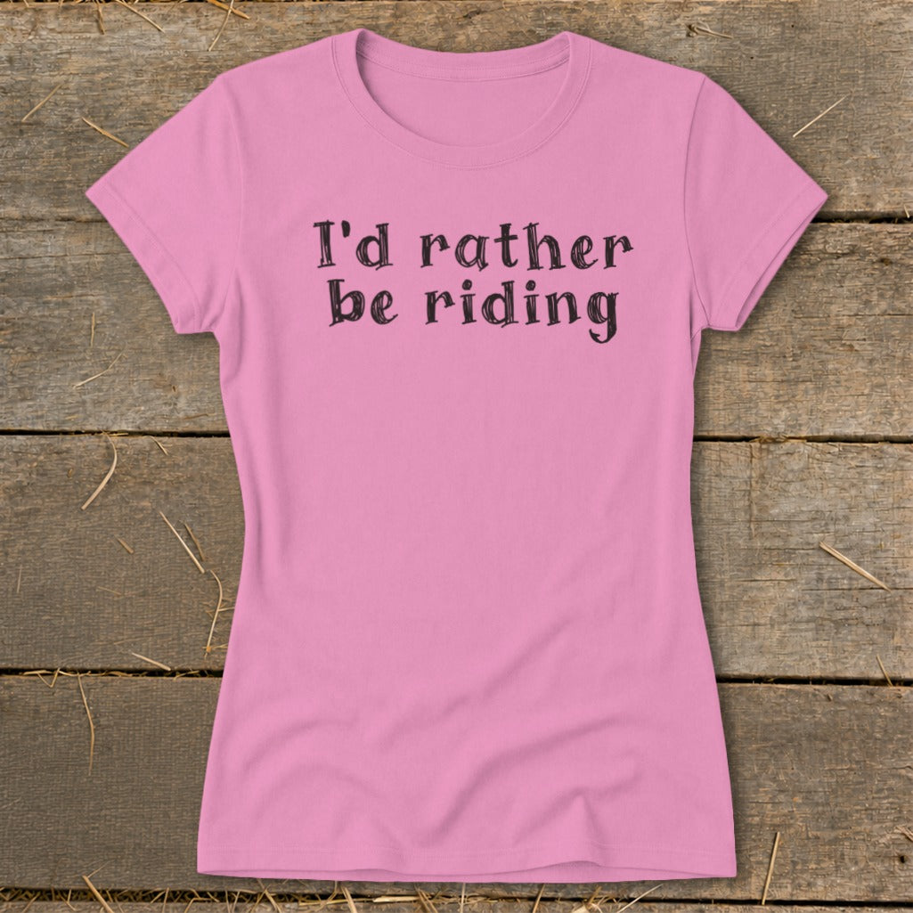 Pink t-shirt with black text "I'd rather be riding"