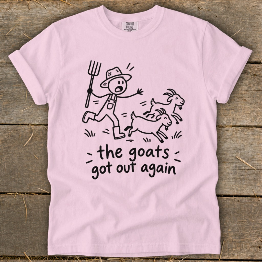 Pink t-shirt with a stick figure farmer chasing goats and text "the goats got out again".