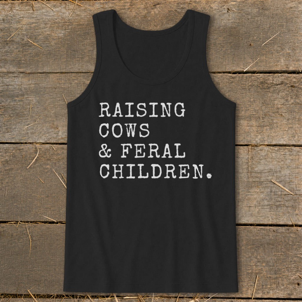 Black tank top with white text: "RAISING COWS & FERAL CHILDREN."