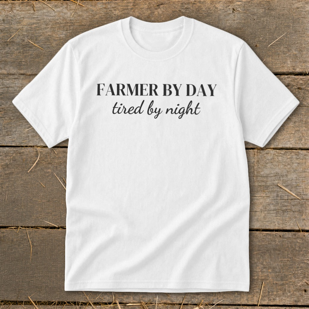 White t-shirt with black text reading "FARMER BY DAY tired by night".