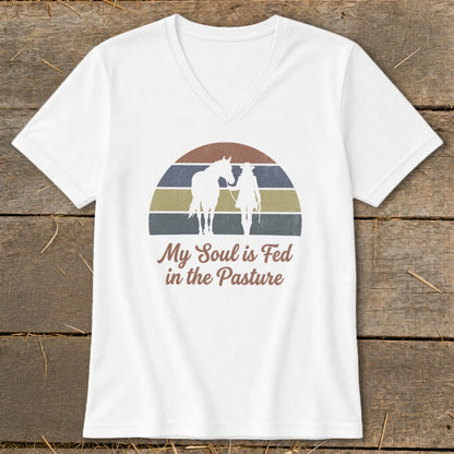 White t-shirt with retro sunset graphic of horse and rider with text "My Soul is Fed in the Pasture."
