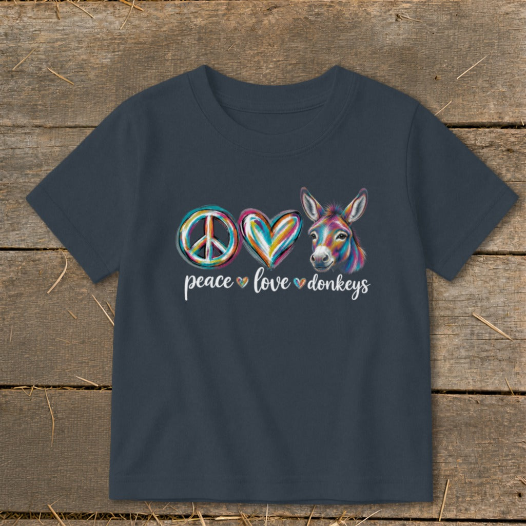 Dark blue t-shirt with peace sign, heart, and donkey graphic, reading "peace love donkeys".