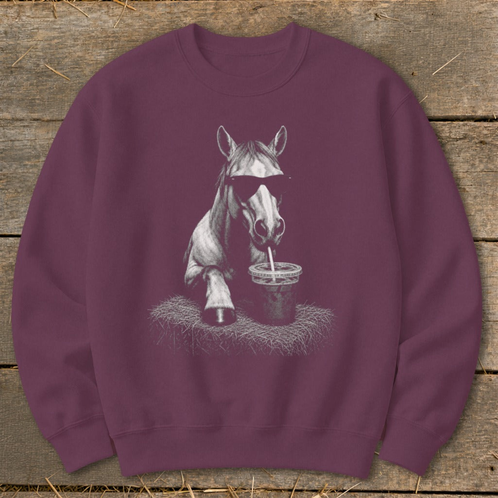 Maroon sweatshirt with a graphic of a horse wearing sunglasses drinking from a cup.