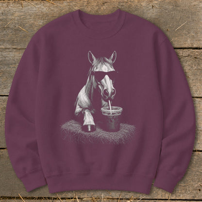 Maroon sweatshirt with a graphic of a horse wearing sunglasses drinking from a cup.