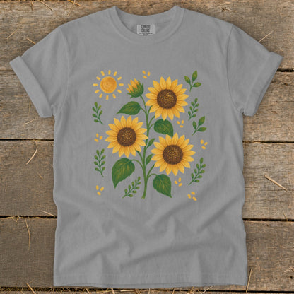 Grey t-shirt with a watercolor illustration of sunflowers and a sun.