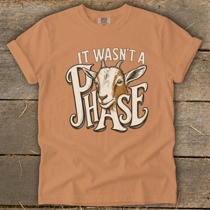 T-shirt with graphic of a goat and text "IT WASN'T A PHASE".