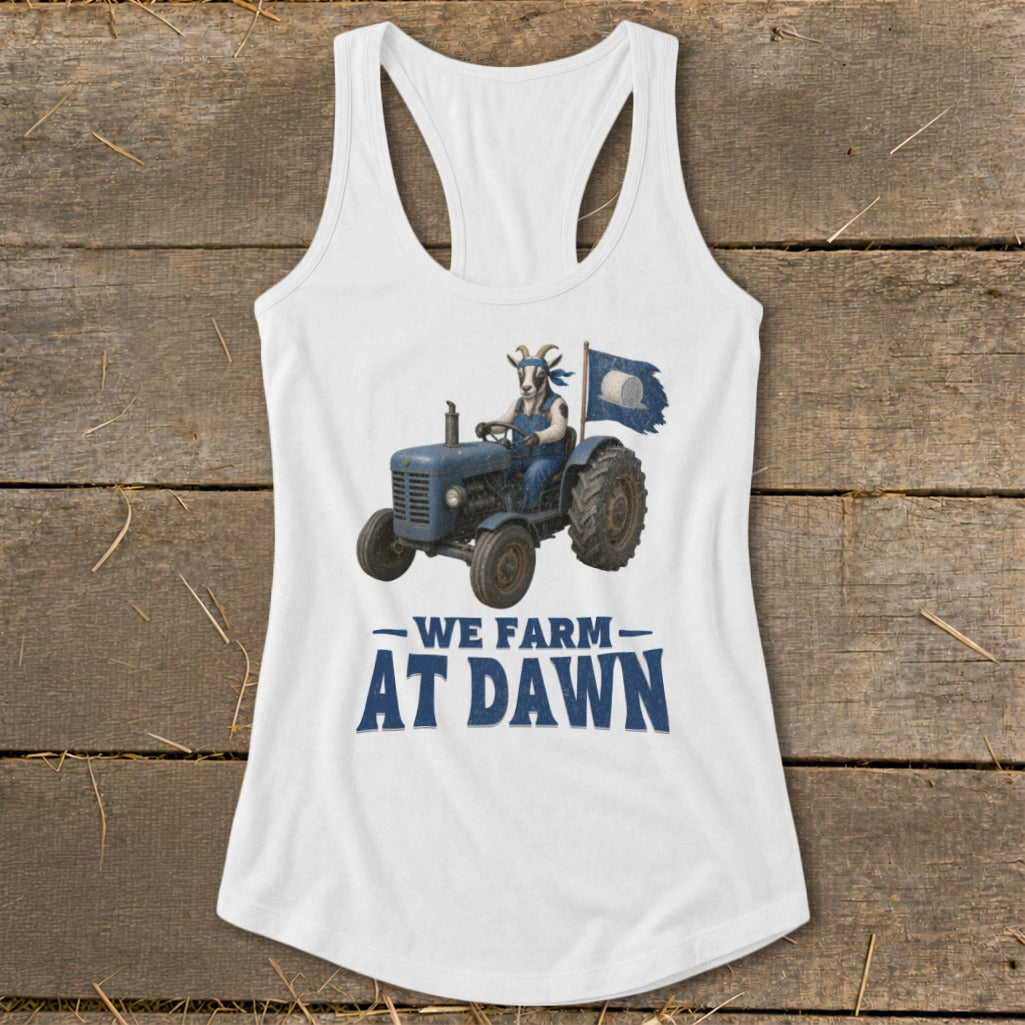 White tank top with graphic of goat driving tractor and text "WE FARM AT DAWN".