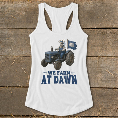 White tank top with graphic of goat driving tractor and text "WE FARM AT DAWN".