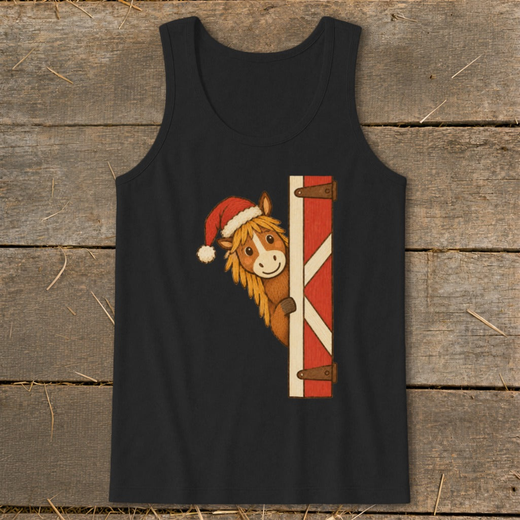Horse wearing Santa hat peeking from barn door on black tank top.