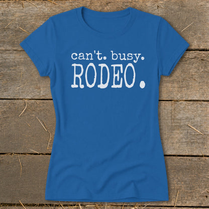 Blue t-shirt with white text reading "can't. busy. RODEO."