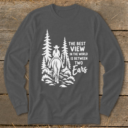 Dark grey long-sleeve t-shirt with a white graphic of a horseback rider and trees, and the text The Best View in the World is Between Two Ears.