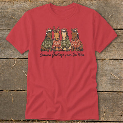 Four horses in Christmas sweaters and Santa hats with "Seasons Greetings from the Herd" text.
