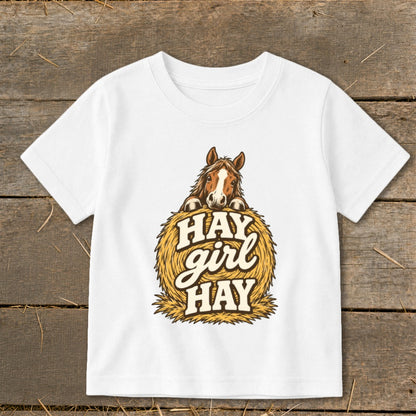 White t-shirt with horse on hay bale graphic that says "Hay Girl Hay".