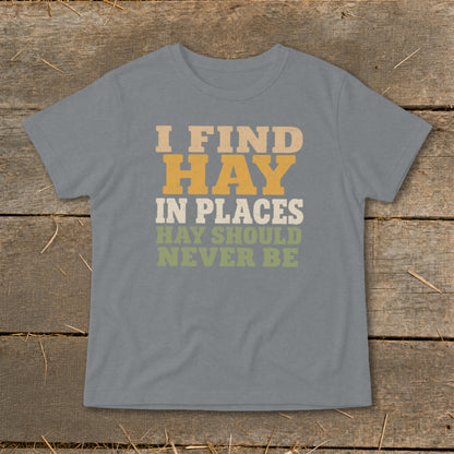 Grey t-shirt with text "I FIND HAY IN PLACES HAY SHOULD NEVER BE".