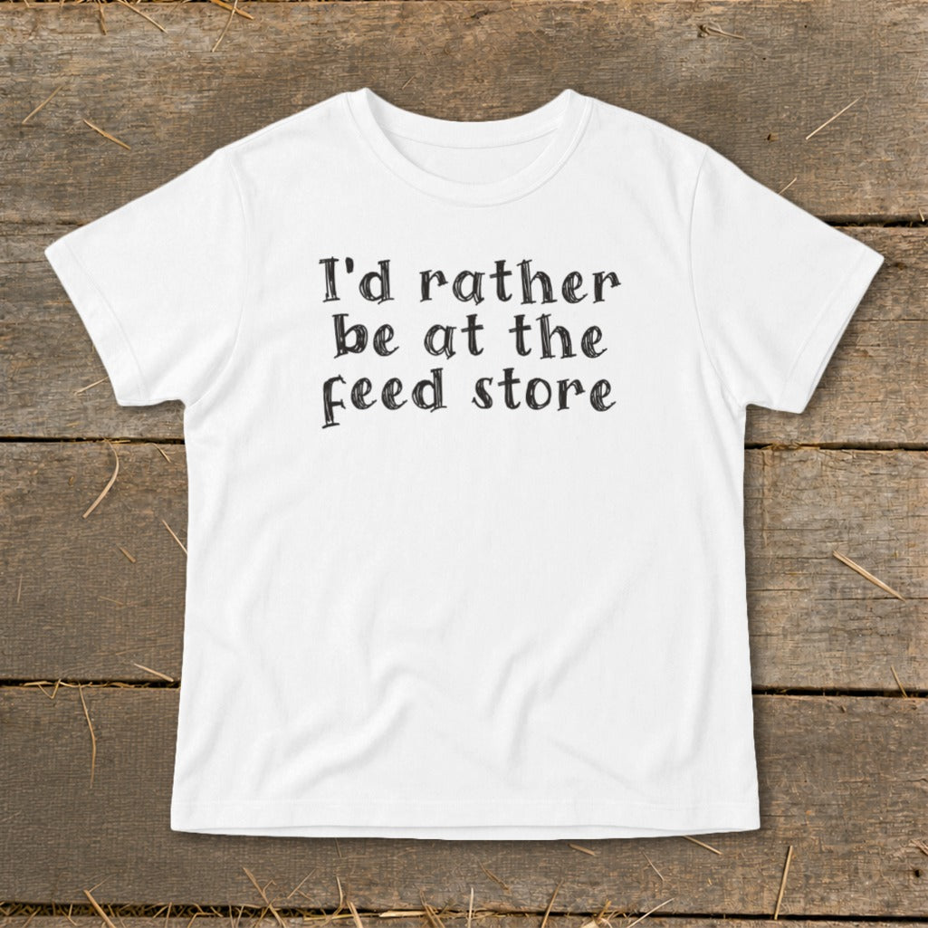 White t-shirt with black text that reads "I'd rather be at the feed store."