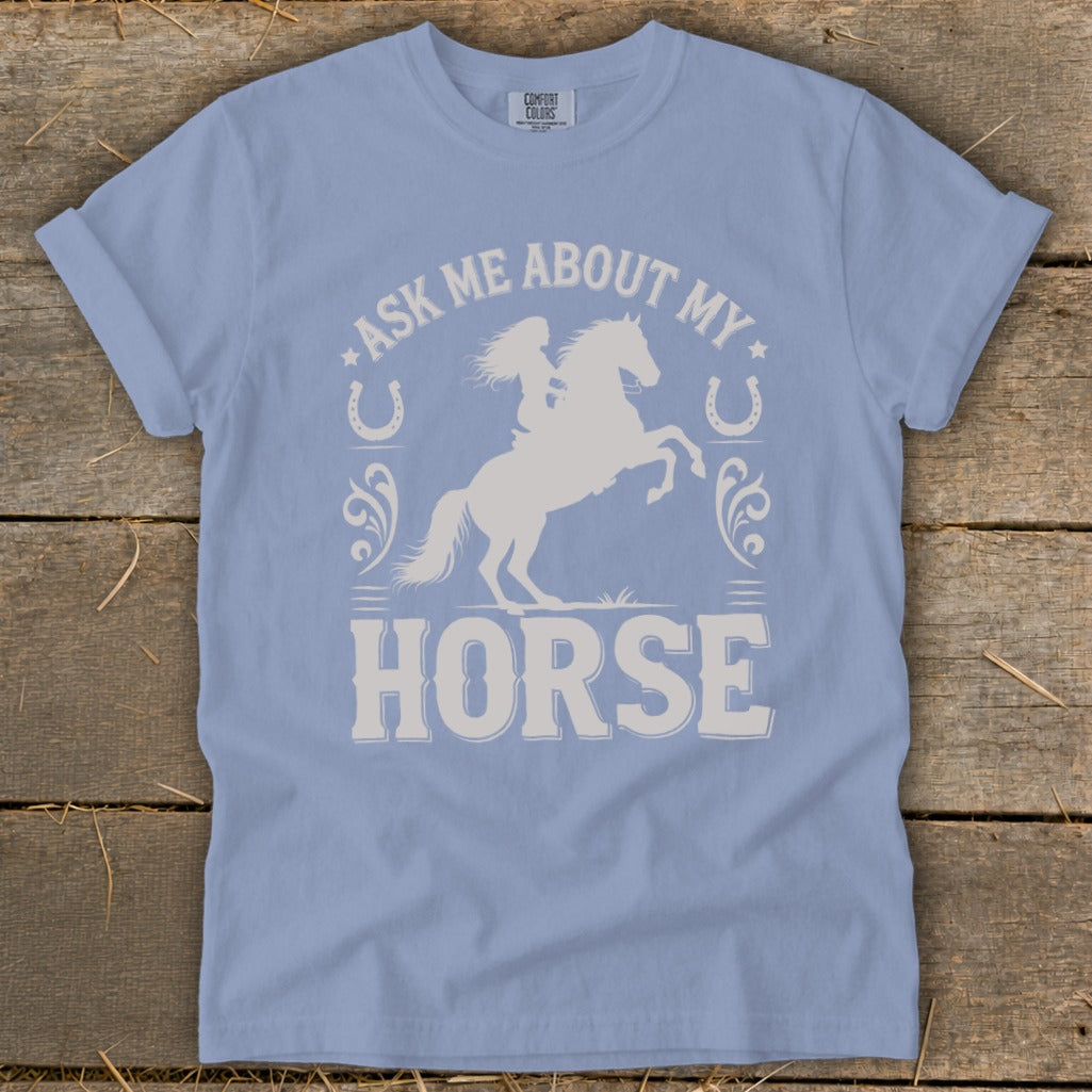 Light blue t-shirt with white graphic: "Ask Me About My Horse" and equestrian silhouette.