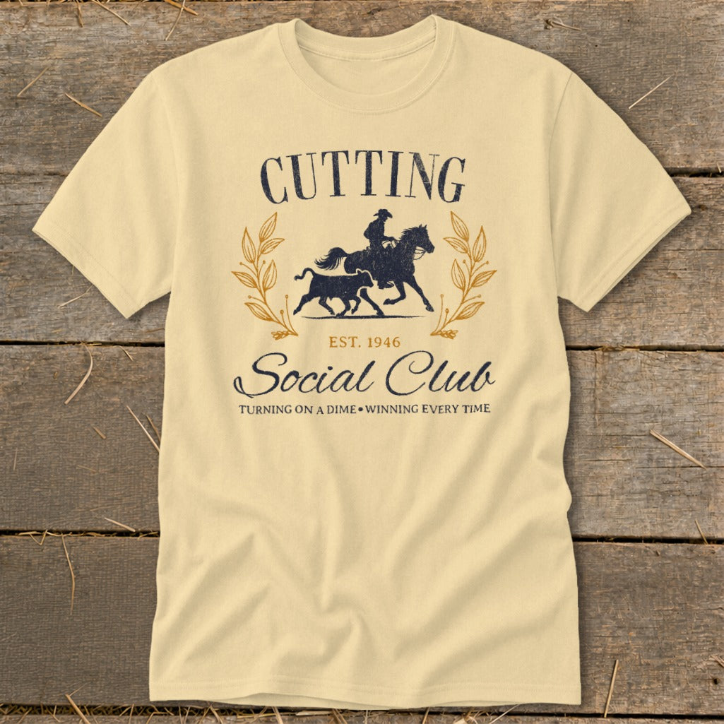 Light yellow t-shirt with "Cutting Social Club" text and horse and calf graphic.