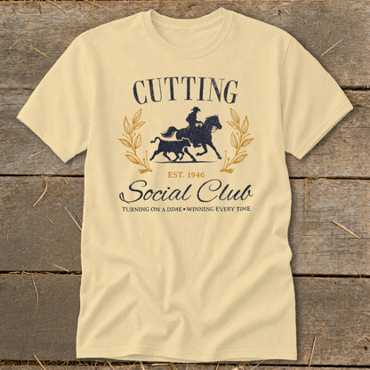 Light yellow t-shirt with "Cutting Social Club" text and horse and calf graphic.