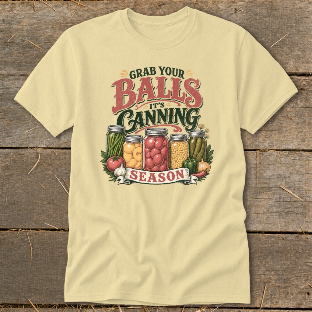 Light yellow t-shirt with "Grab Your Balls It's Canning Season" text and jars of preserved food.