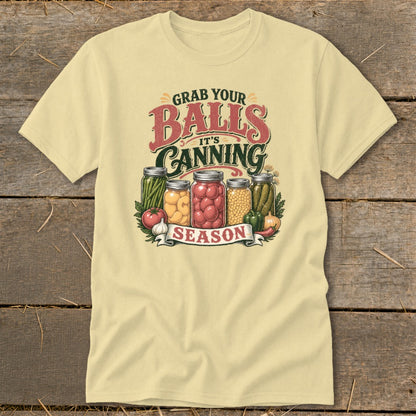 Light yellow t-shirt with "Grab Your Balls It's Canning Season" text and jars of preserved food.