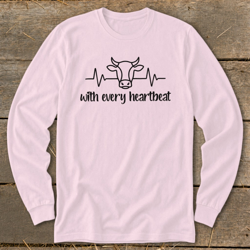 Pink long sleeve shirt with cow heartbeat design and text "with every heartbeat".