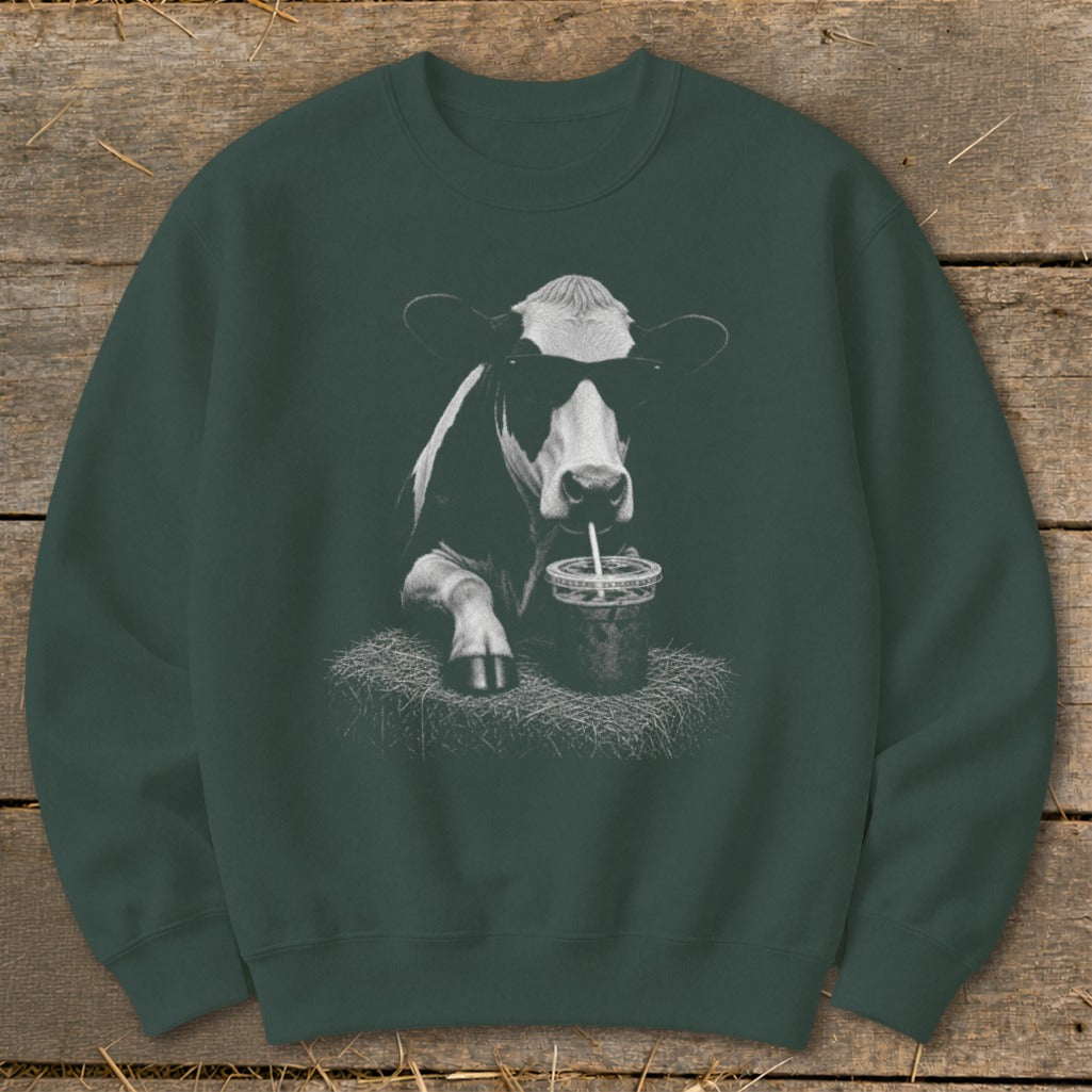 Graphic of cow wearing sunglasses, drinking from a cup with a straw.