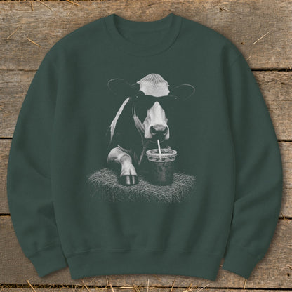 Graphic of cow wearing sunglasses, drinking from a cup with a straw.