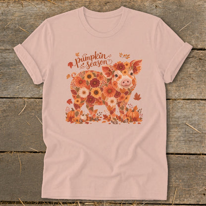Pink t-shirt with a pig design made of autumn flowers and leaves.