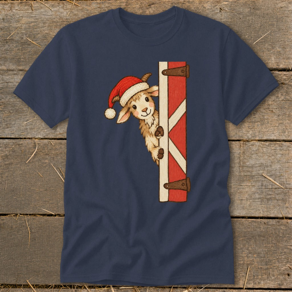Goat wearing Santa hat peeking from behind a red barn door.